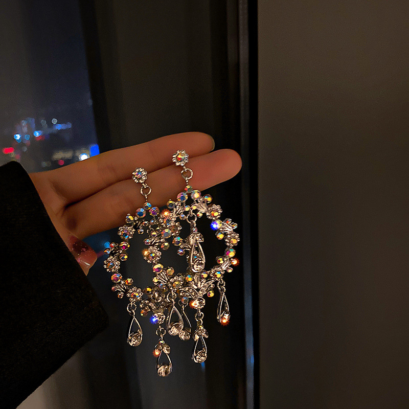 925 aguja de plata de Europa y América hueco pendientes de gota de agua hembra 2023 temperamento pendientes borla largos pendientes personalizados al por mayor