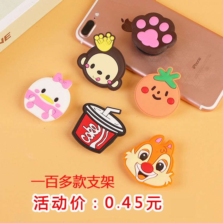 En stock al por mayor TikTok Cartoon creativo soporte de teléfono móvil puede soportar airbag soporte de teléfono móvil soporte de escritorio