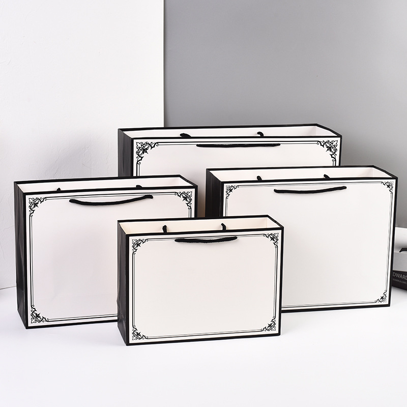 现货黑边框纸袋服装店购物袋男女装手提袋 纸质服装袋批发包装袋