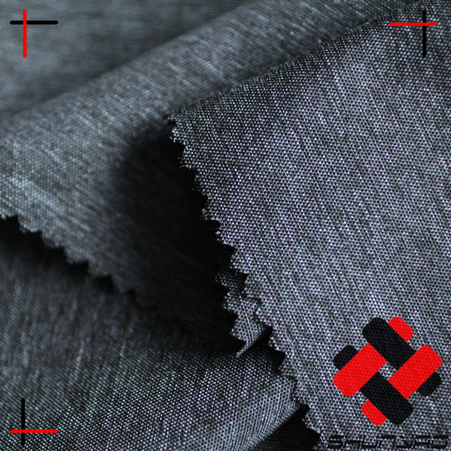 舜尧 锦涤空变并网混色面料 仿牛仔夹克布料