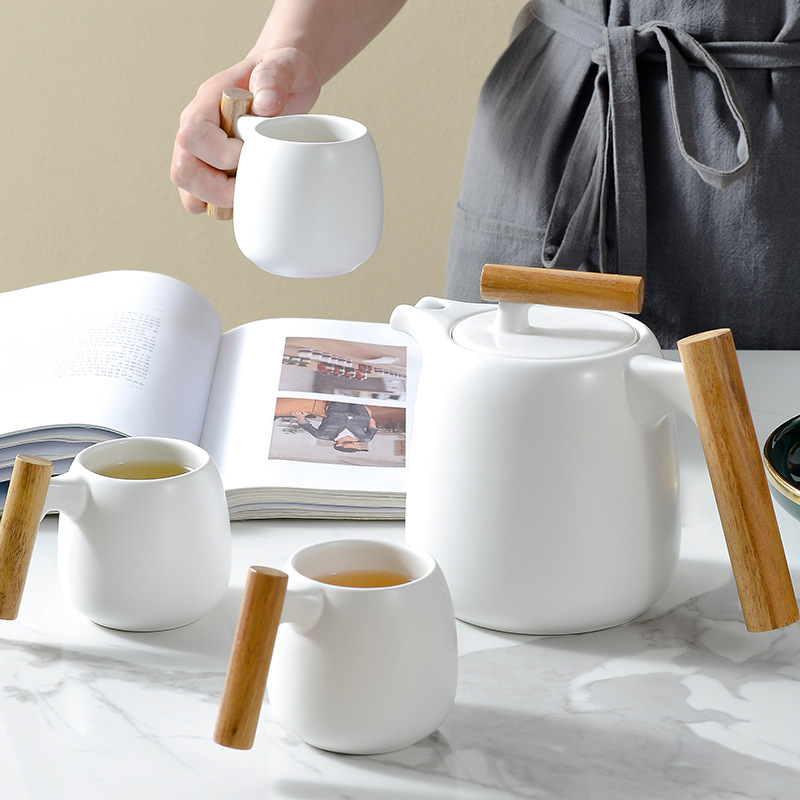 Juego de té de marea nacional creativo con manita de madera, caja de regalo de tetera de mármol fresco japonés, regalo de bienes raíces
