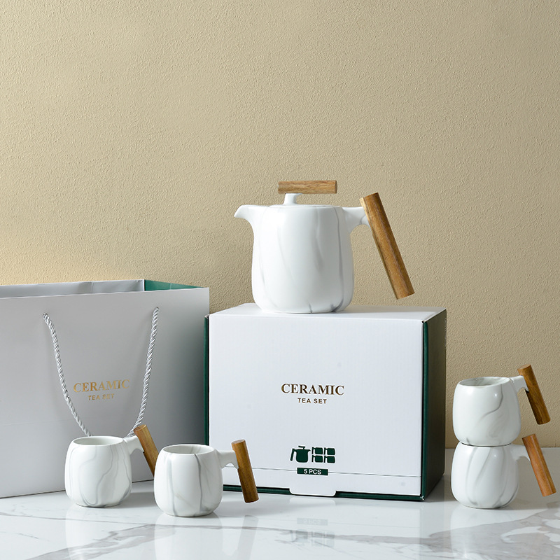 Juego de té de marea nacional creativo con manita de madera, caja de regalo de tetera de mármol fresco japonés, regalo de bienes raíces