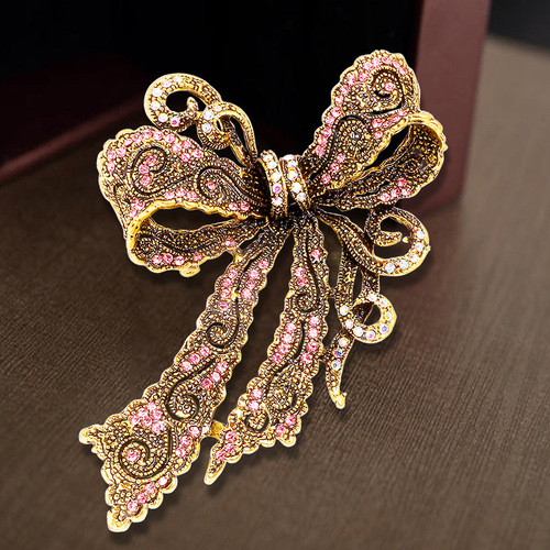 Cross-border hot selling creative rhinestone brooch alloy electroplated retro bow women's corsage high-end accessories pin