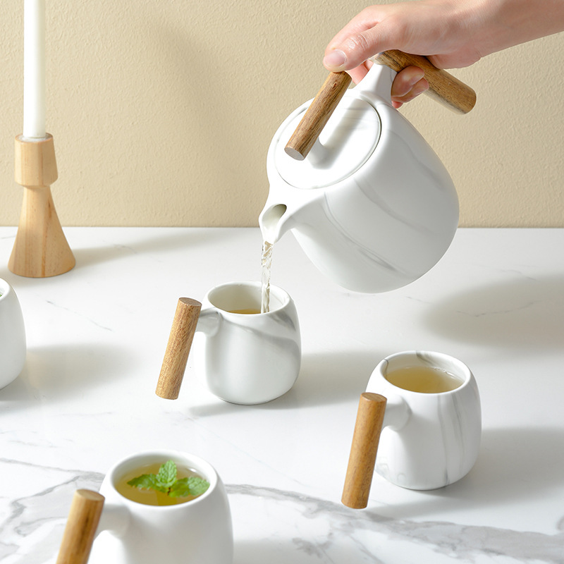 Juego de té de marea nacional creativo con manita de madera, caja de regalo de tetera de mármol fresco japonés, regalo de bienes raíces