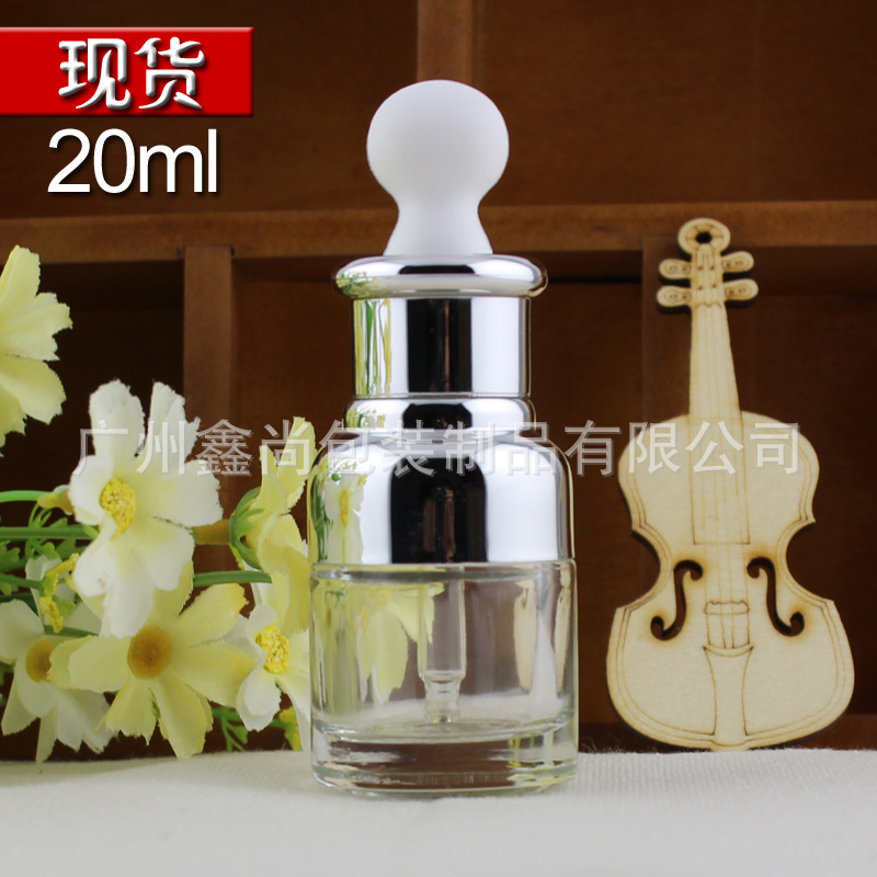 Botella de vidrio transparente de alta gama 20ml botella de esencia cabeza de goma plana botella de aceite esencial botella cuentagotas botella de líquido cosmético vacío