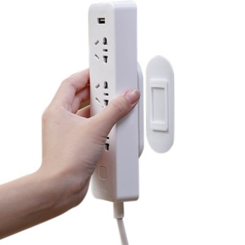 Row plug holder etiqueta de la pared colgante de almacenamiento sin fisuras fila Punch-free plug Board socket colgante de pared adhesivo