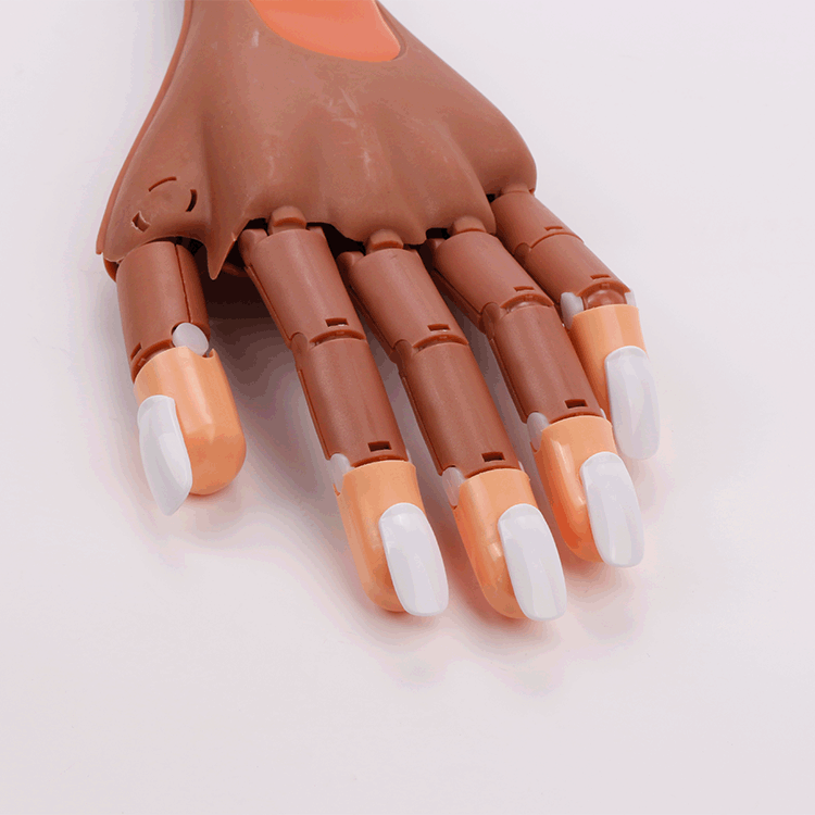 Manicura al por mayor conjunta flexible artificial mano a juego práctica clavo pieza bolsa móvil mano manipulador uñas pieza tres colores