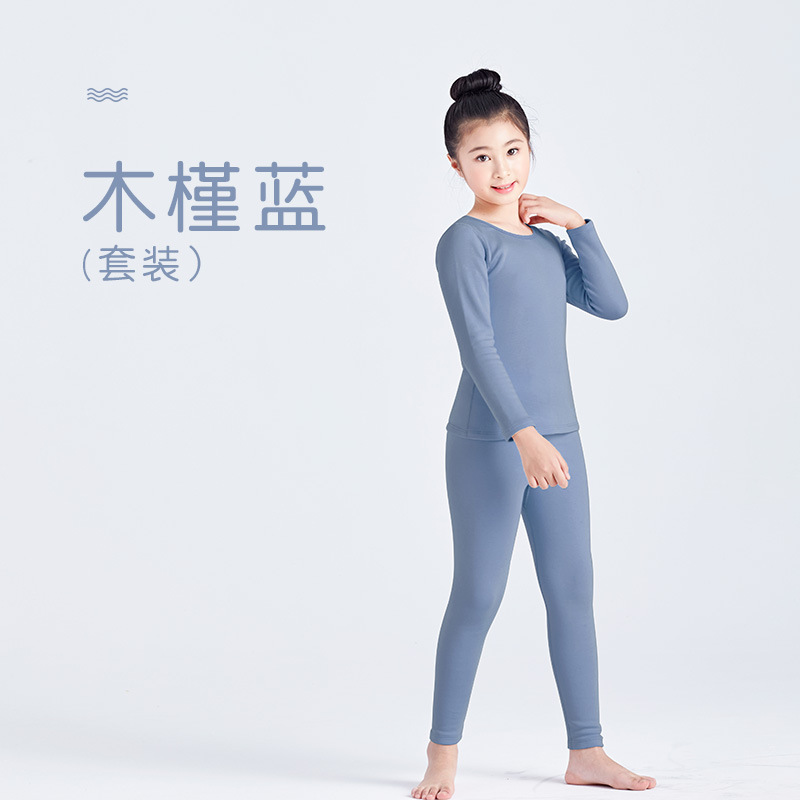 Ropa interior térmica de terciopelo camisa de fondo sin costuras niños y niñas ropa de otoño pantalones largos medio y grandes niños otoño e invierno sin costura ajustada al por mayor