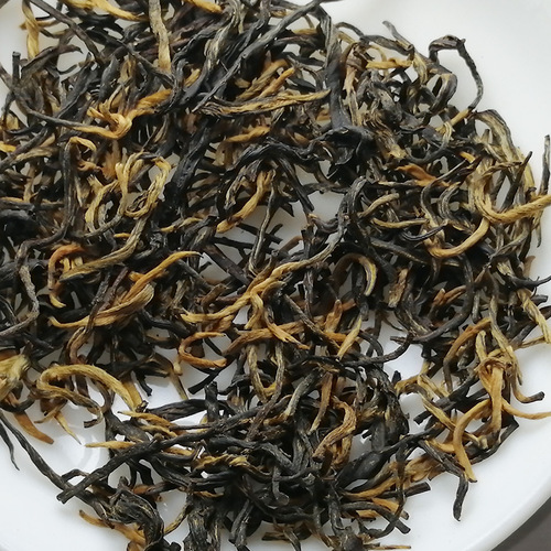 Fujian Wuyishan Jin Jun Mei high mountain floral small species black tea milk tea raw material rich aroma type yellow bud Jin Jun Mei tea leaves