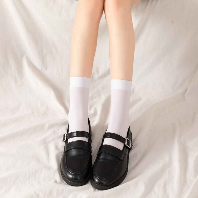 Calcetines de becerro blancos y negros transpirables de color sólido calcetines de estudiante cortos de terciopelo fino sobre la rodilla calcetines de moda versátiles