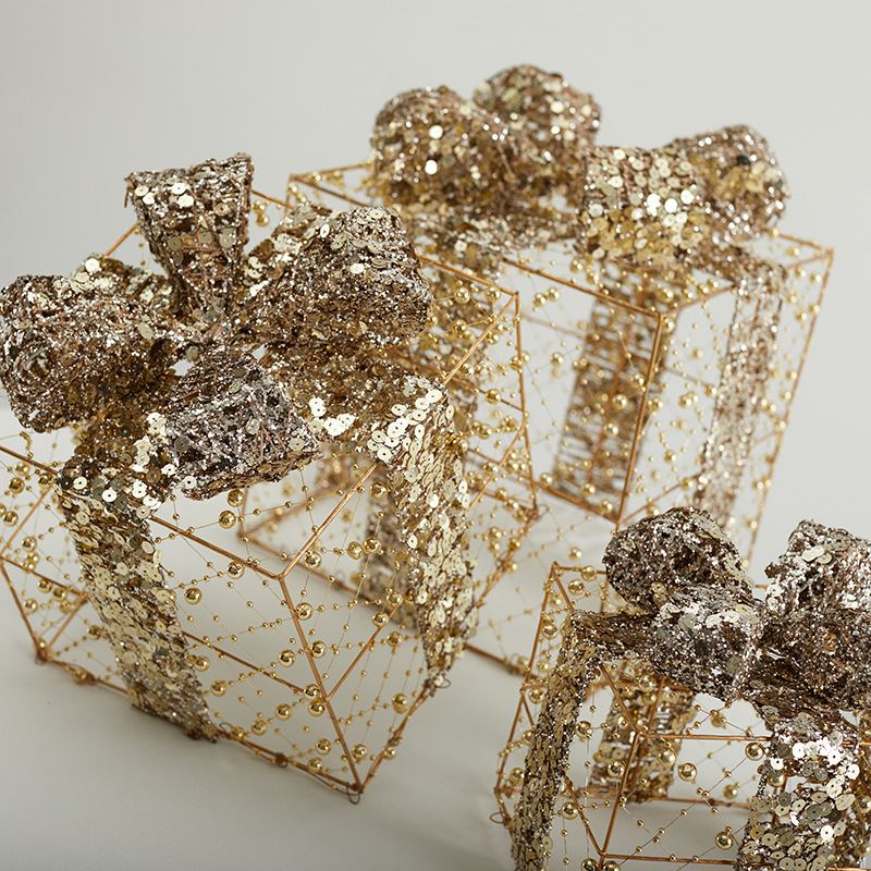 Navidad hierro forjado paquete de tres piezas hotel centro comercial ventana decoración de pavimento esquinilla oro paquete de regalo pila cabeza