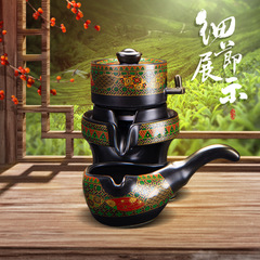 Wholesale ceramic automatic gongfu tea set with gold-plated embossed floral design, creative stone mill rotating water outlet, lazy anti-scald LOGO