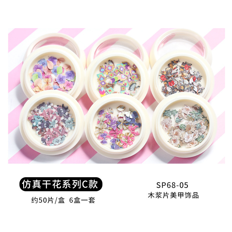 Conjunto de joyas de uñas populares transfronterizas nueva mariposa de uñas flor colorida flor seca lentejuelas desgaste joyería de uñas