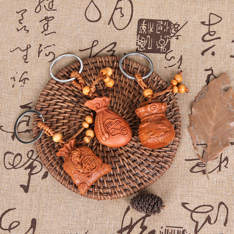 Scenic spot night market wooden pendant carved peach wood three-dimensional keychain money bag lucky bag gift pendant in stock wholesale Scenic spot night market wooden pendant carved peach wood three-dimensional keychain money bag lucky bag gift pendant in stock wholesale