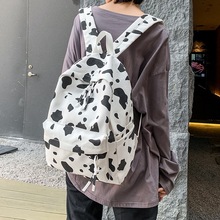 秋冬新款个性奶牛纹双肩包尼龙大容量中学生书包时尚休闲旅行背包