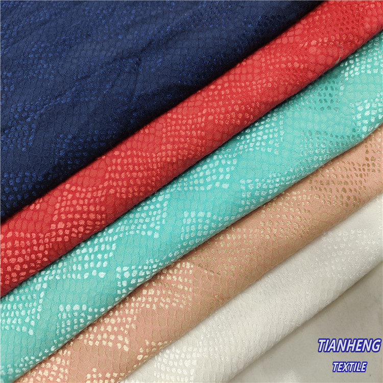 H-9067#涤棉混纺纬弹仿蕾丝蛇纹提花女装套装外套连衣裙箱包面料