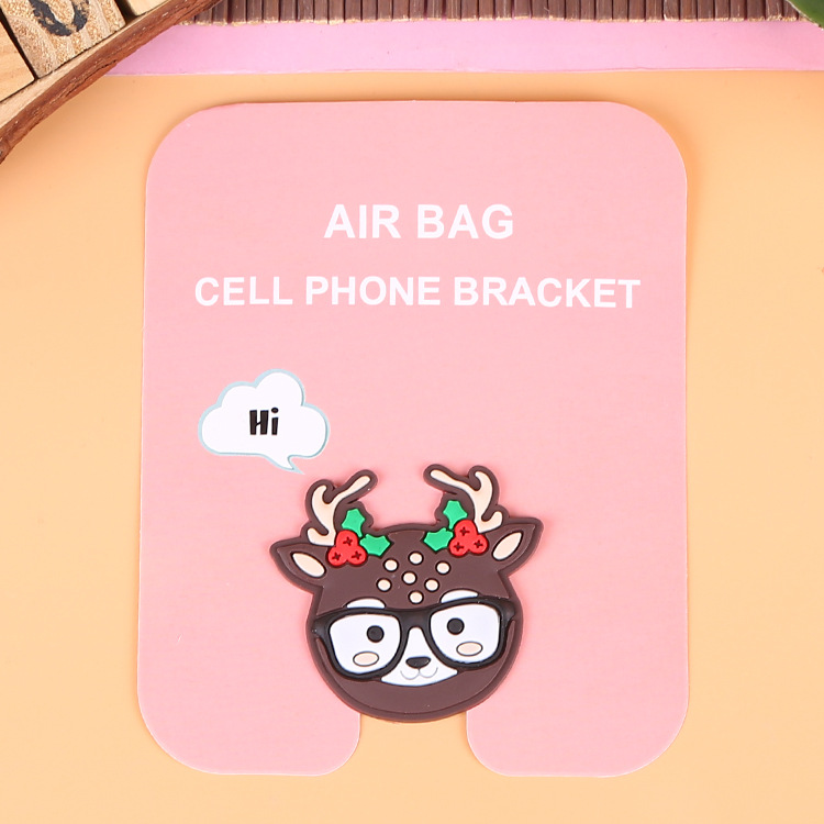 En stock al por mayor TikTok Cartoon creativo soporte de teléfono móvil puede soportar airbag soporte de teléfono móvil soporte de escritorio
