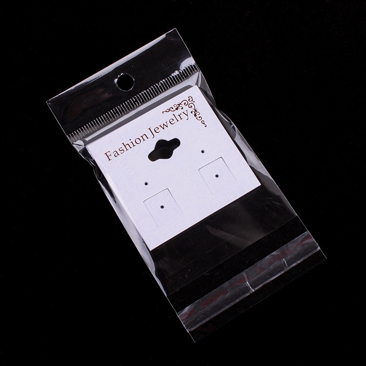 厂家直销  包装饰品透明opp袋子 6*11cm 内空6*6带挂头带胶