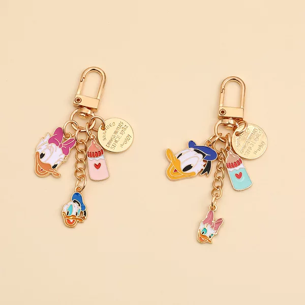 New Cartoon Metal Duck Keychain Creative Personality Couple airpods Headset Pendant Car Key Chain