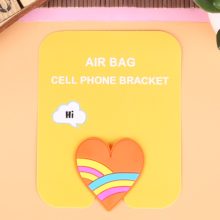 En stock al por mayor TikTok Cartoon creativo soporte de teléfono móvil puede soportar airbag soporte de teléfono móvil soporte de escritorio