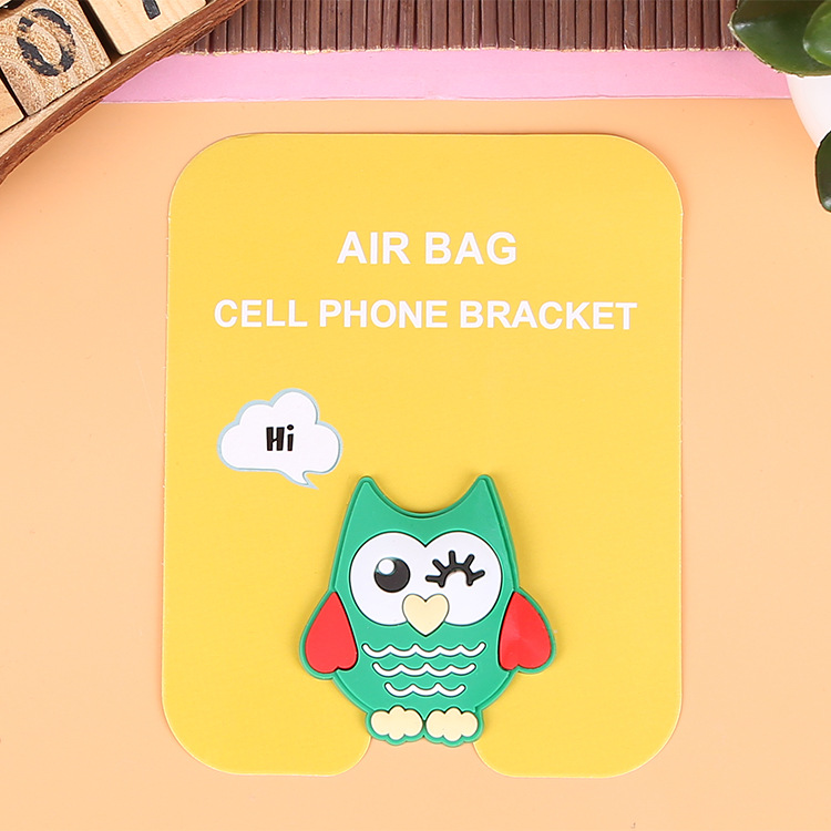 En stock al por mayor TikTok Cartoon creativo soporte de teléfono móvil puede soportar airbag soporte de teléfono móvil soporte de escritorio