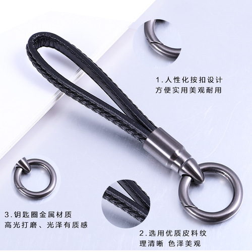 Creative bullet-shaped rotating keychain for men and women, genuine leather car keychain, alloy pendant, advertising gift item.