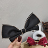 Three dimensional retro brand hairgrip with bow