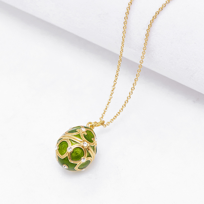 Collana con ciondolo a forma di uovo pasquale apribile in smalto succoso di Qingdao Jewelry, catena per maglione a forma di cuore e fiocco di neve._voghion.com
