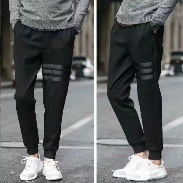 Pantalones deportivos casuales de primavera y otoño para hombres pantalones de chándal pantalones harén flacos pantalones atados al tobillo Pantalones slim fit hombres de moda coreana