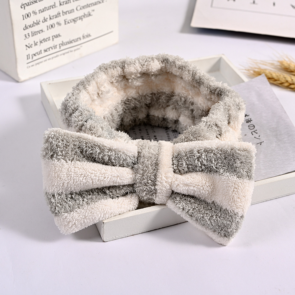 Factory daily necessities Korean coral fleece makeup cute plush girl makeup gift bow hair band accessories