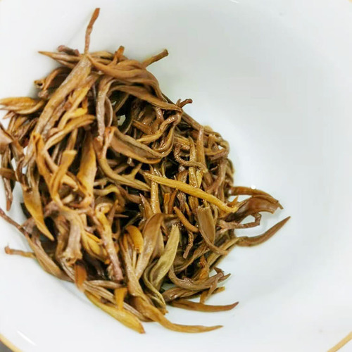 Wholesale Yunnan 2024 Large Leaf Dian Hong Black Tea Single Bud Artisanal Red Tea Honey Aroma Golden Silk Dian Hong Black Tea from a 70-year-old factory
