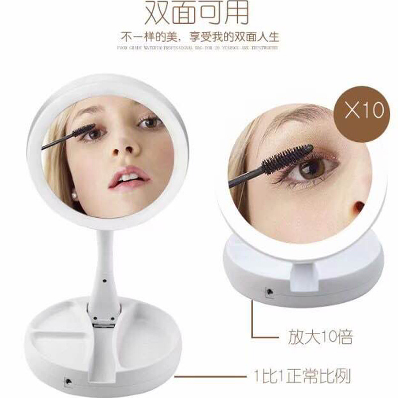 LED creativo de doble cara Espejo de belleza de escritorio plegable inteligente Luz de relleno portátil espejo de mano con luz espejo de maquillaje