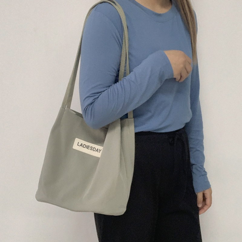 Nylon impermeable bolsa de lona de las mujeres de un solo hombro japonés Harajuku estudiante universitario ins Internet celebridad simple cien bolsa de tela de moda