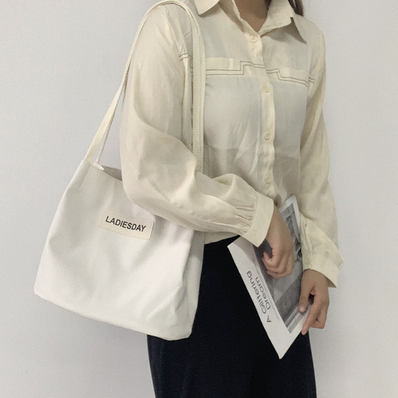 Nylon impermeable bolsa de lona de las mujeres de un solo hombro japonés Harajuku estudiante universitario ins Internet celebridad simple cien bolsa de tela de moda