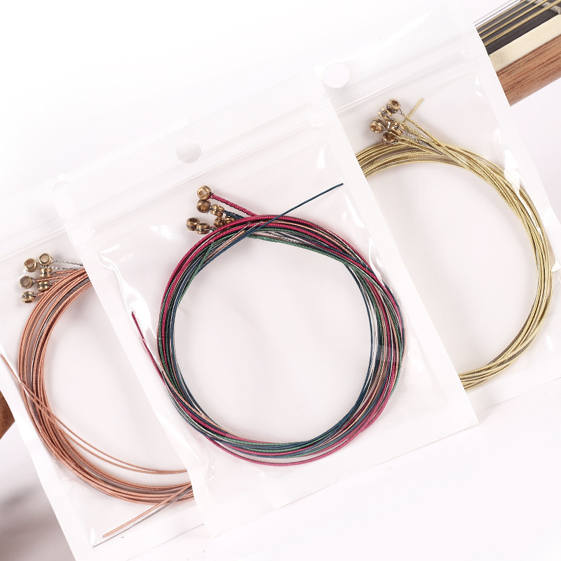 Guitarra de madera cuerdas de latón guitarra folk cuerdas de acero 6 cuerdas folk a granel cuerdas de fábrica cuerdas de guitarra al por mayor