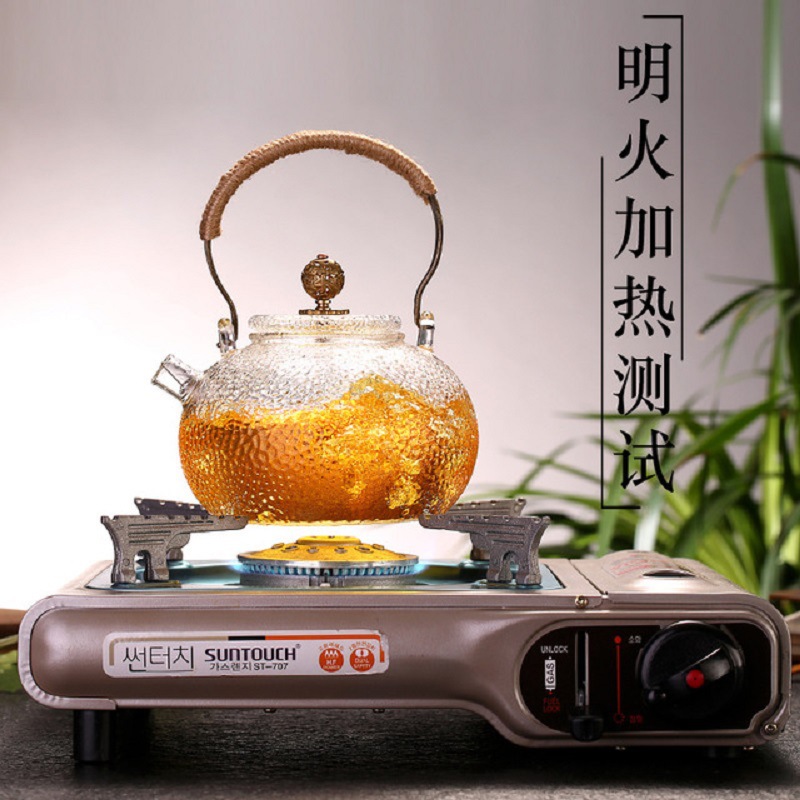 Fábrica al por mayor tetera de vidrio borosilicato hogar juego de té flor tetera de cobre martillado tetera fabricante de té