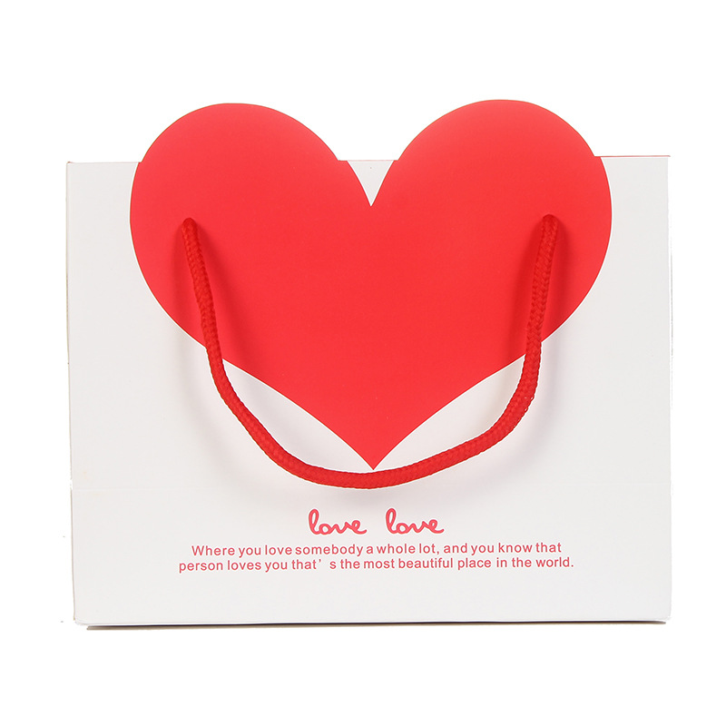Fábrica en stock al por mayor bolsa de regalo de amor bolsa de regalo de boda bolsa de papel de embalaje portátil logotipo impreso en forma de corazón