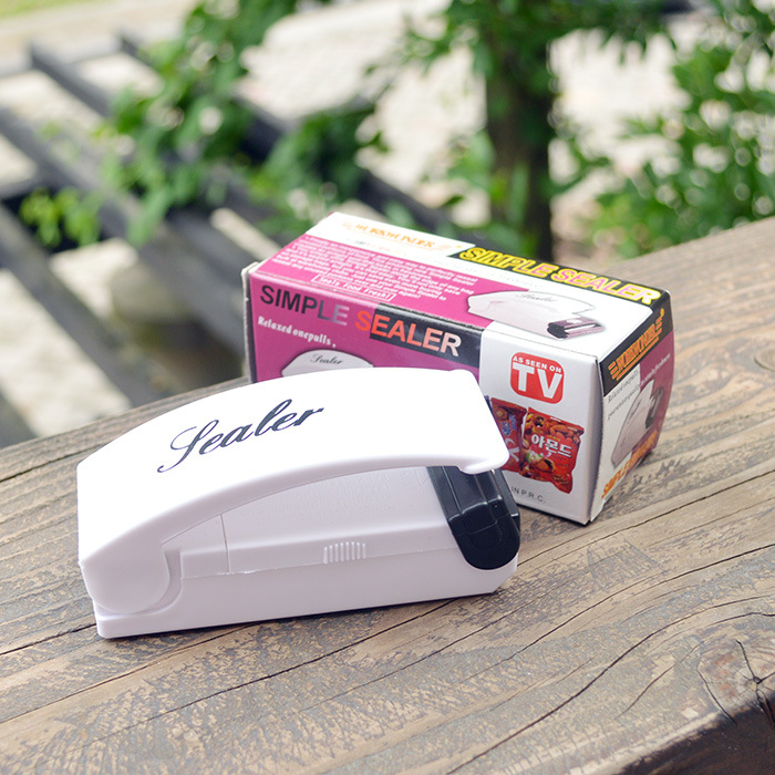 Máquina de sellado del hogar pequeña máquina de sellado del hogar bolsa de alimentos bolsa de plástico presión de la mano máquina de sellado ventas directas de la fábrica