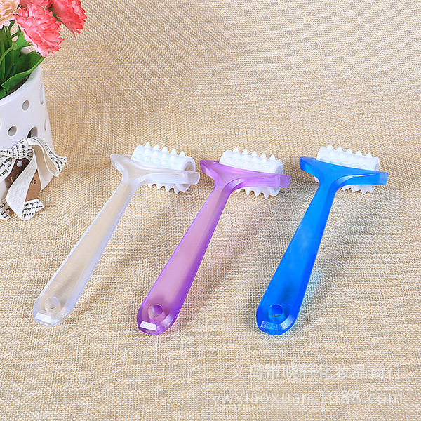 small multicoloured plastic cosmetic massager for face