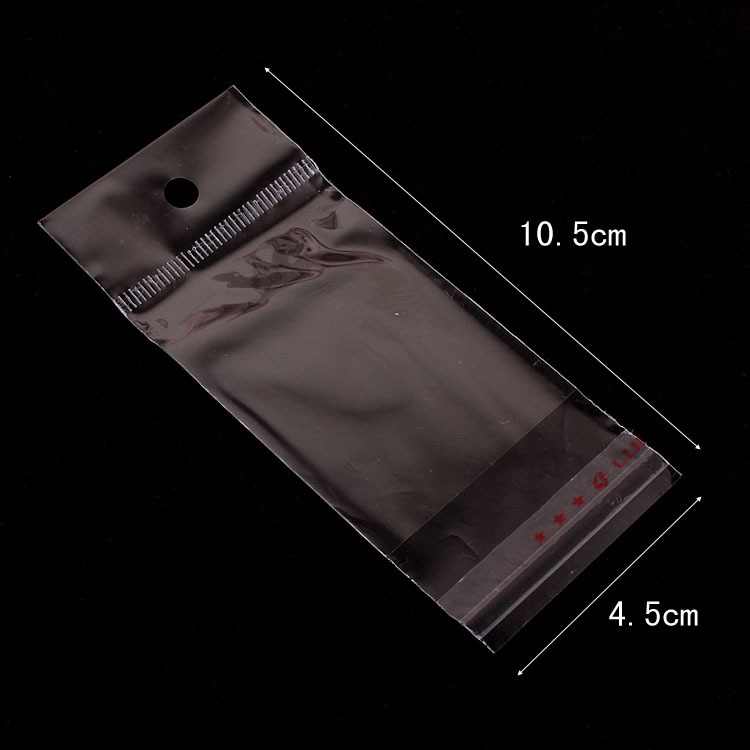 厂家直销  包装饰品透明opp袋子4.5*10.5cm内空4.5*5 带挂头带胶