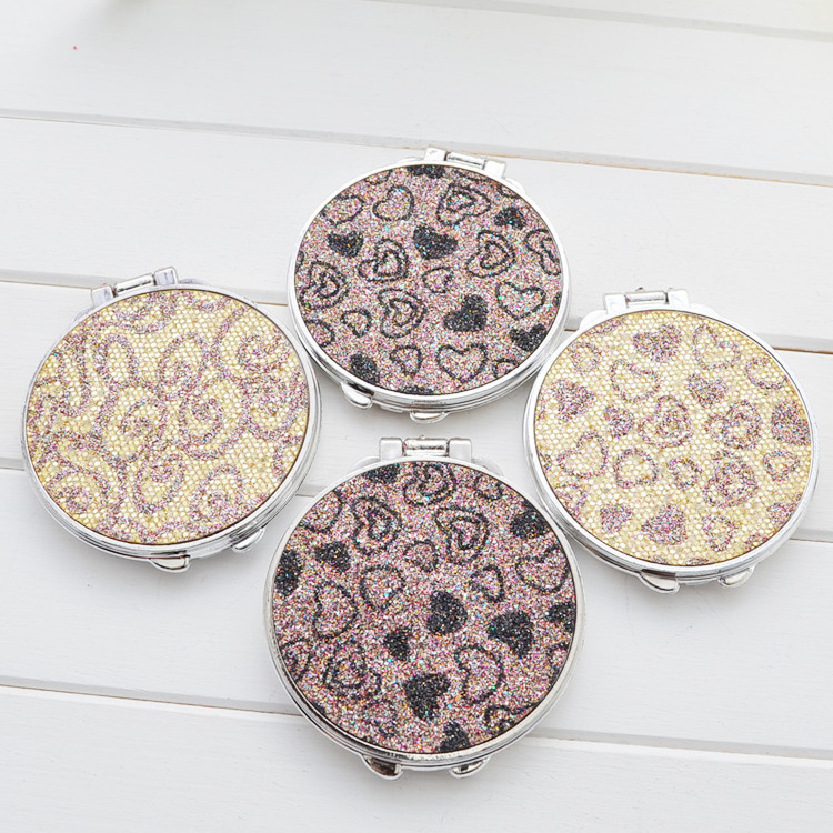 Folding double-sided compact mirror, plastic electroplated frame, Ø 7 cm, 0.7 cm thick (random color)