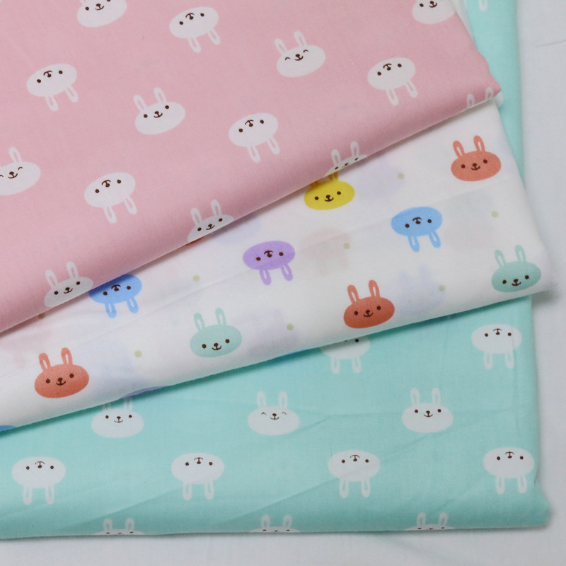 全棉斜纹面料棉衣布料 卡通小兔子印花布 幼儿园床单被罩纯棉布料