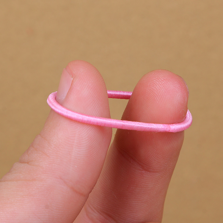 Venta caliente en línea cuerda de pelo 100 piezas banda de pelo para niños bebé color caramelo cuerda de pelo niña banda de goma accesorios para el cabello al por mayor