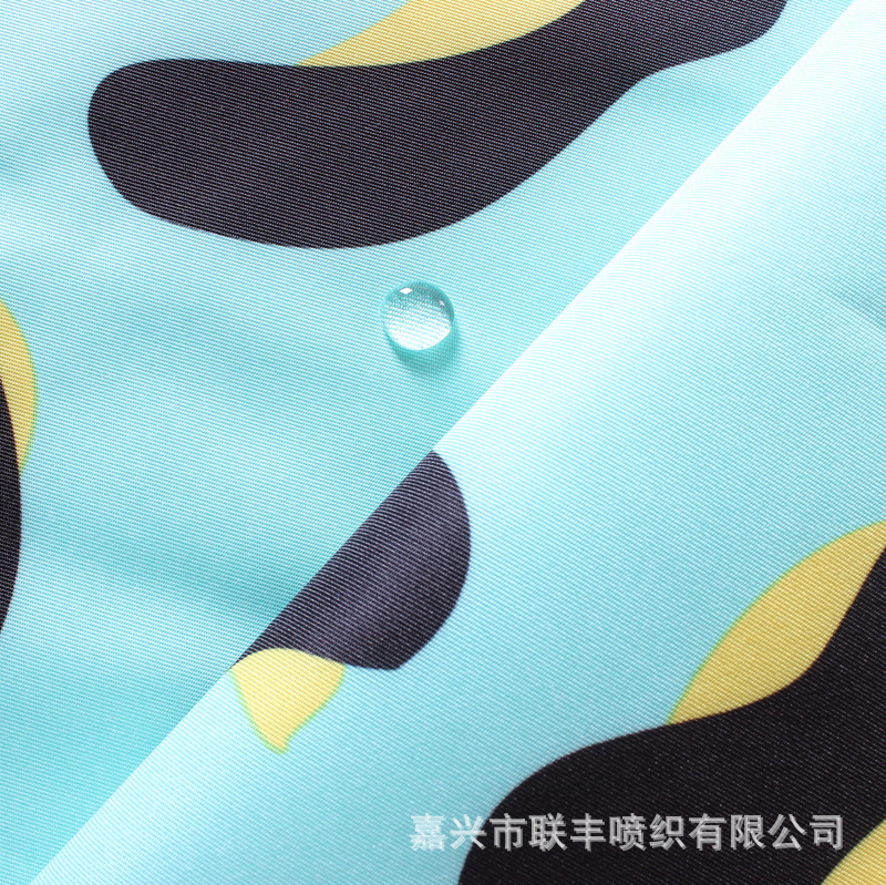 320D涤纶塔丝隆绿牛奶纹转移印花透气透湿白 醒目滑雪服冲锋衣料