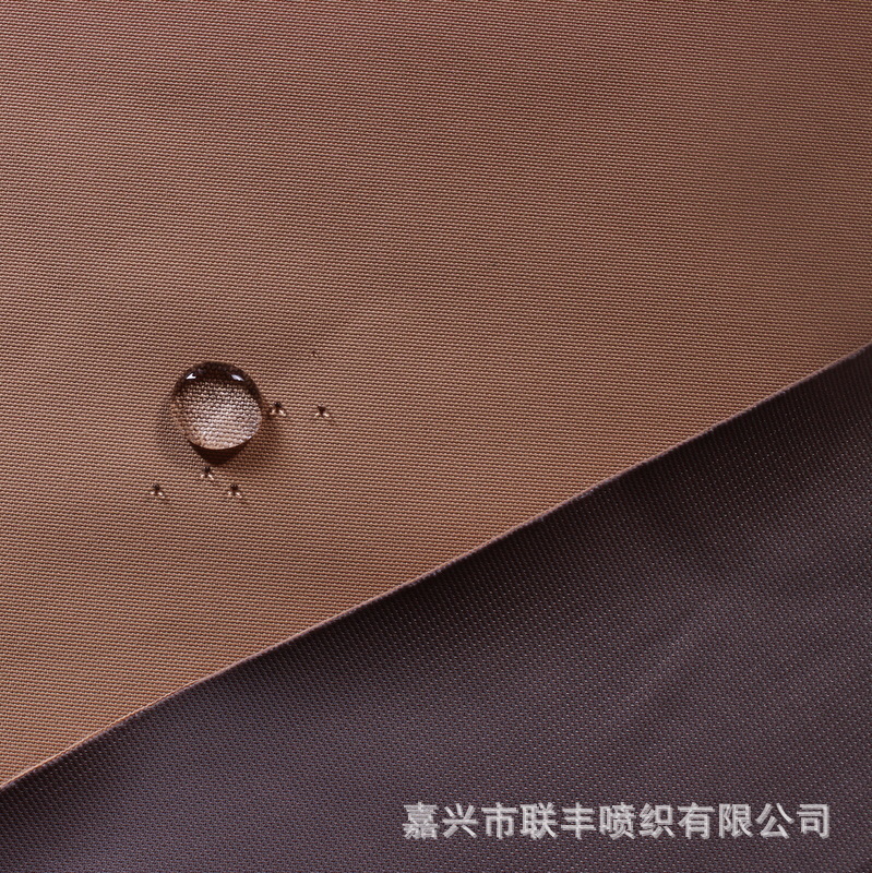 供应300D消光涤纶低弹牛津布三合一防水透气透湿冲锋衣滑雪服面料