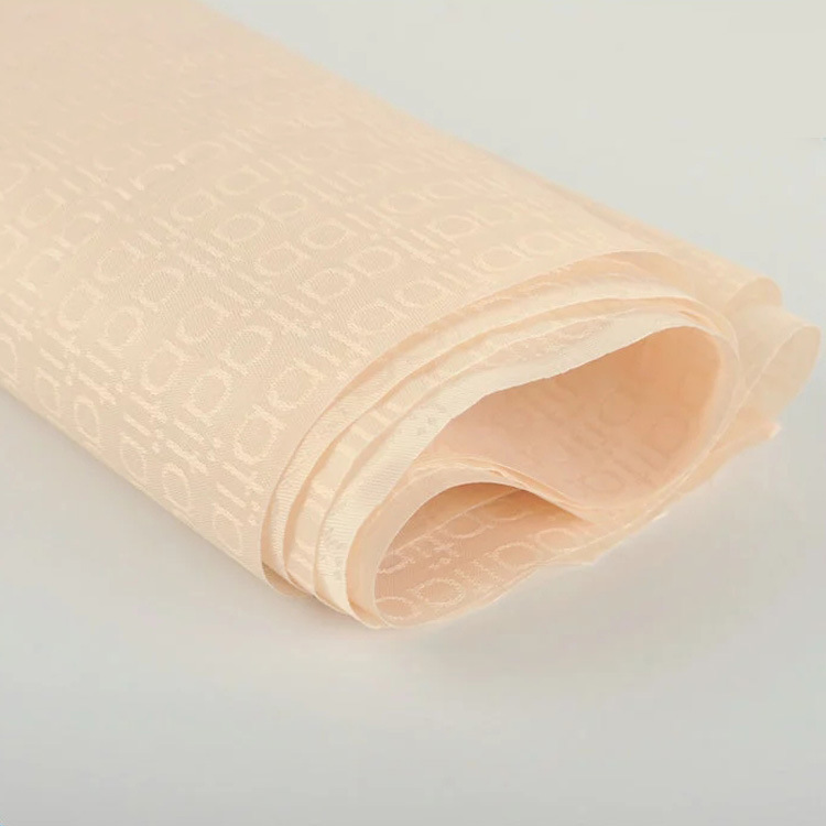 厂家供应新款涤纶梭织提花布面料休闲时装涤纶提花布家用亲肤面料