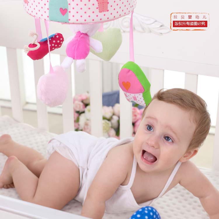 Giratorio Rosa conejo cama campana música giratoria cama colgante con tela de felpa bebé sonajero fábrica al por mayor