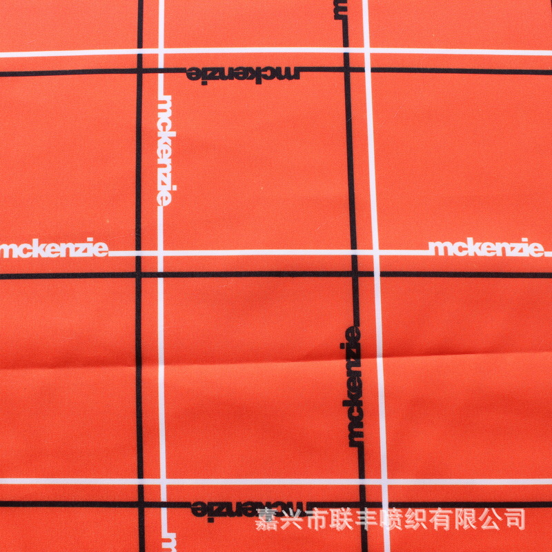 供应110gsm平纹桃皮绒加橘色格子加logo热转移印花 沙滩裤短裤布