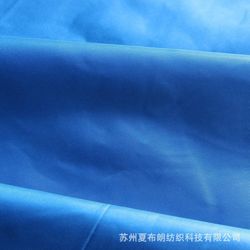 厂家直销300T涤塔夫平纹压光防绒儿童轻薄羽绒服棉衣涤纶面料