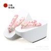White ground - pink flower stalk